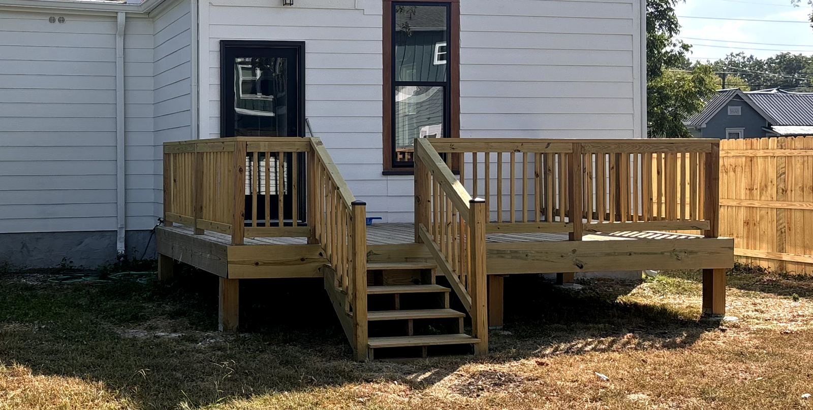 Back deck with stairs and railing