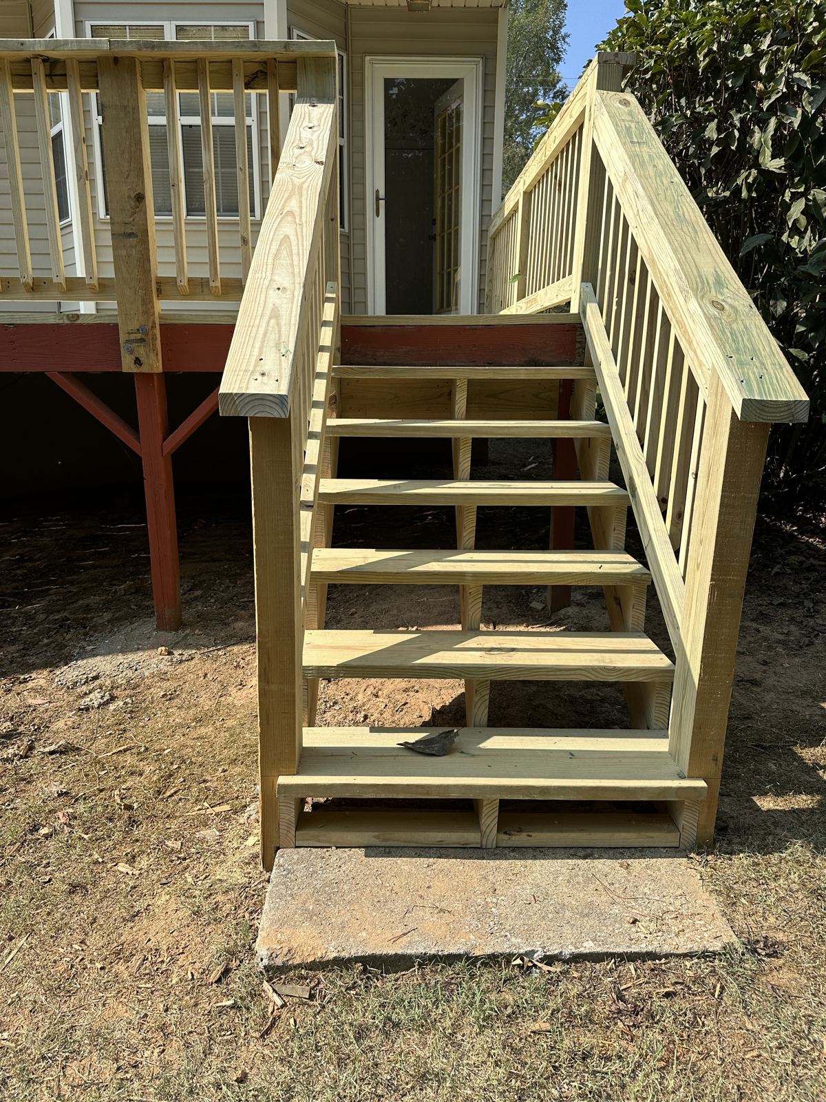 New wood deck stairs with handrails in Chattanooga